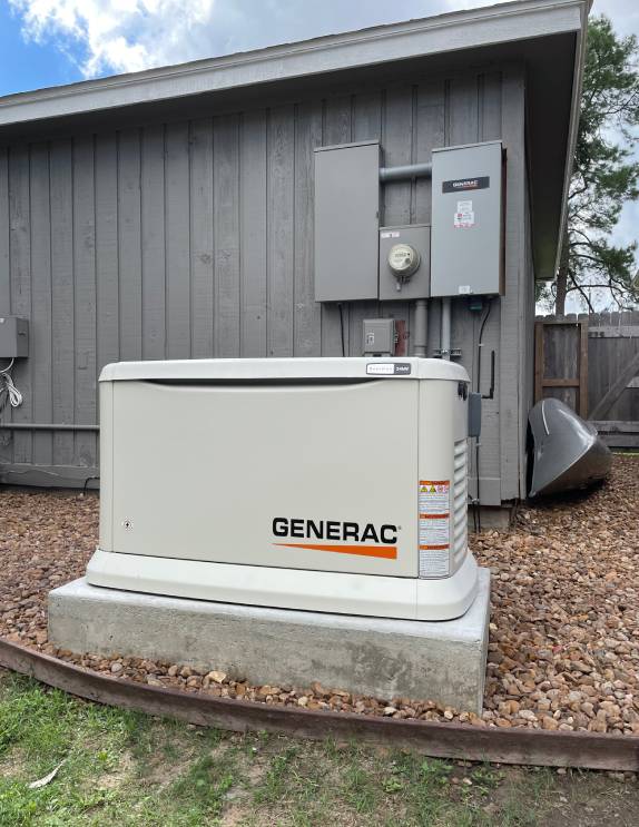 A Generac backup generator installed outside a building.